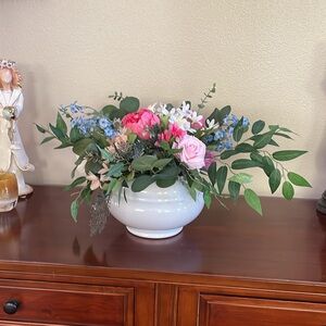 Large silk floral arrangement in ceramic vase